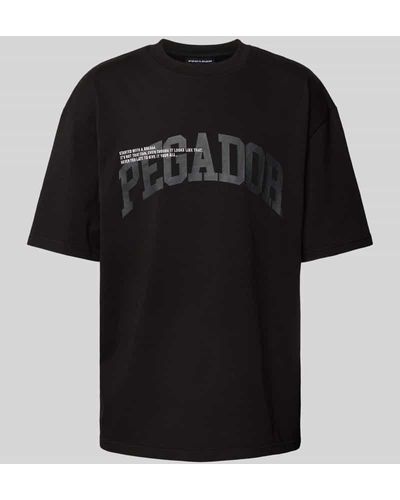 PEGADOR Oversized T-Shirt mit Label-Print und Rundhalsausschnitt - Schwarz
