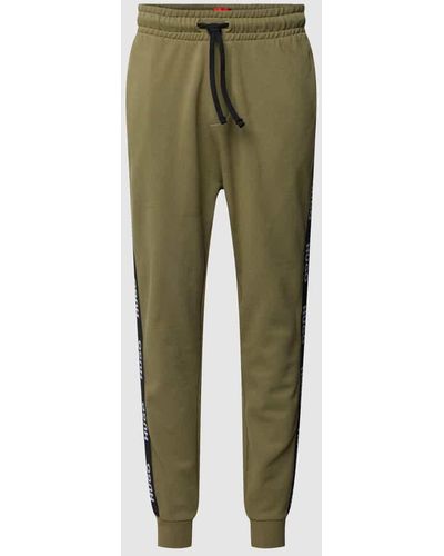 HUGO Sweatpants aus Baumwolle mit Galonstreifen Modell 'Sporty' - Grün