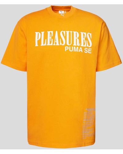 PUMA T-Shirt mit Label-Print - Orange