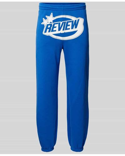 Review Regular Fit Sweatpants mit Label-Print - Blau