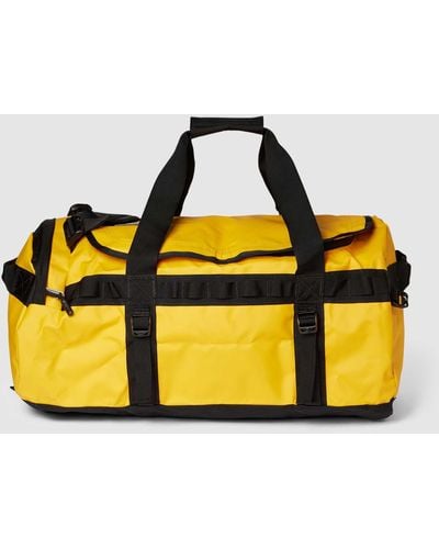 The North Face Weekender mit Label-Print Modell 'BASE CAMP DUFFEL M' - Gelb