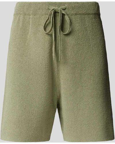 Nanushka Shorts aus Frottee - Grün