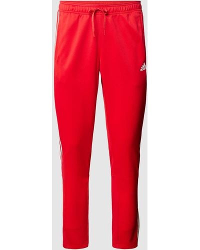 adidas Sweatpants mit Logo-Streifen - Rot