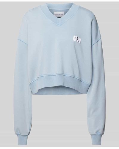 Calvin Klein Oversized Sweatshirt mit V-Ausschnitt - Blau