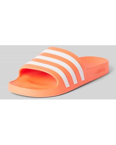 adidas Slides mit labeltypischen Streifen Modell 'ADILETTE AQUA' - Pink