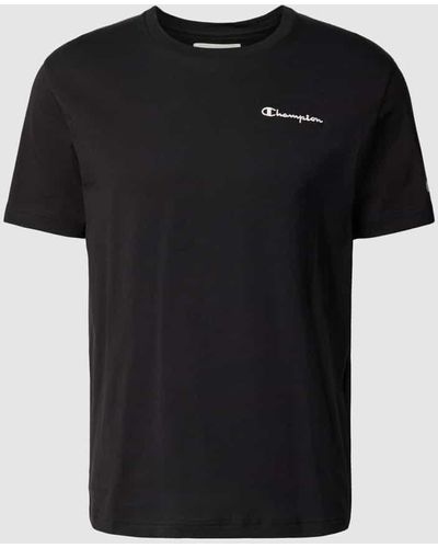 Champion T-Shirt mit rückseitigem Statement-Print - Schwarz