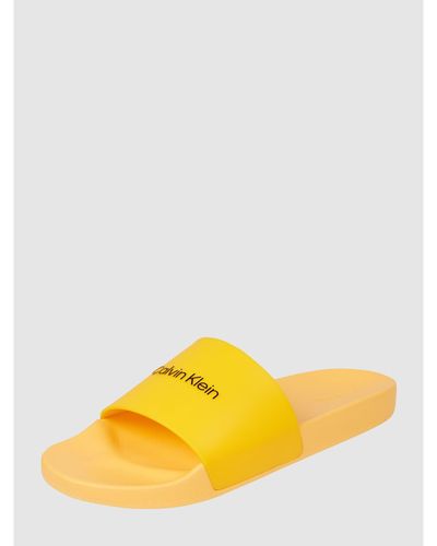 Calvin Klein Slides mit Logo - Gelb