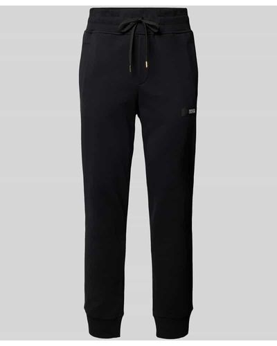 Versace Tapered Fit Sweatpants mit Label-Badge - Schwarz