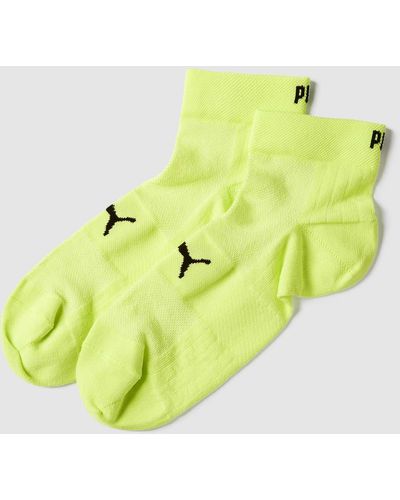 PUMA Socken mit eingewebten Label-Details im 2er-Pack Modell 'Quarter' - Gelb