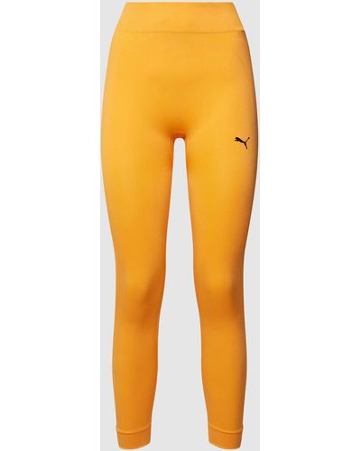 PUMA Leggings mit Logo-Print Modell 'STUDIO FOUNDATIONS SEAMLE' - Orange