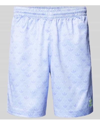 adidas Originals Regular Fit Sweatshorts mit Allover-Muster - Blau