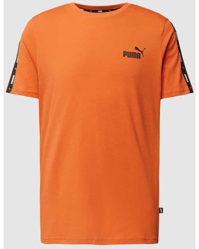 PUMA T-Shirt mit Galonstreifen - Orange