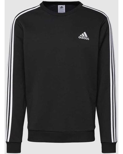 adidas Sweatshirt mit labeltypischen Galonstreifen - Schwarz