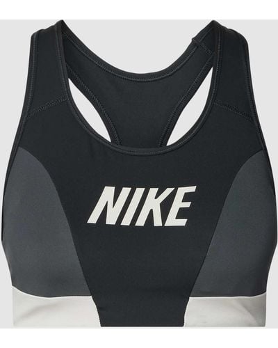 Nike Sport-BH mit Label-Print - Schwarz