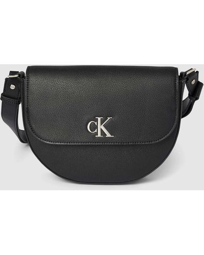 Calvin Klein Saddle Bag mit Label-Applikation Modell 'MINIMAL MONOGRAM' - Schwarz
