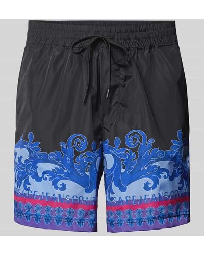 Versace Regular Fit Shorts mit Muster- und Label-Print - Blau