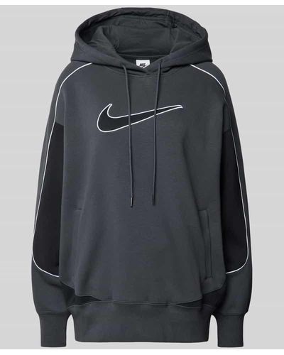 Nike Oversized Hoodie mit Logo-Stitching - Schwarz