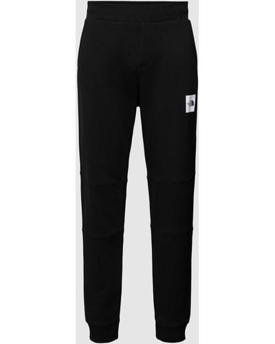The North Face Regular Fit Sweatpants Met Labelprint - Zwart