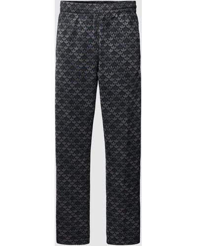 adidas Originals Sweatpants mit Allover-Label-Print - Grau