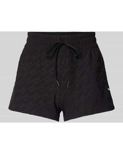 PUMA Shorts mit Logo-Muster - Schwarz