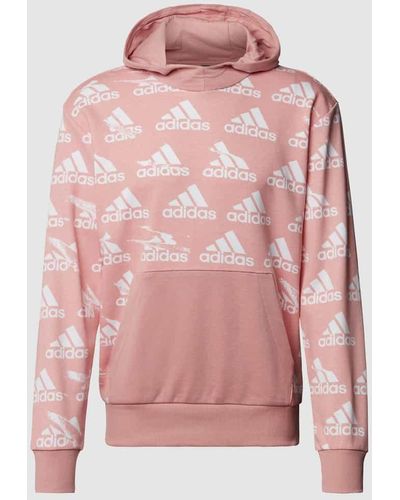 adidas Hoodie mit Allover-Logo-Print - Pink
