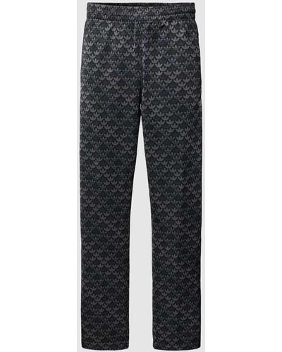 adidas Originals Sweatpants mit Allover-Label-Print - Grau