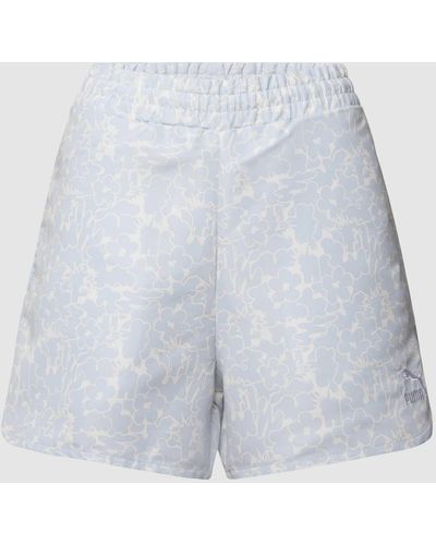 PUMA Shorts mit floralem Allover-Muster - Blau
