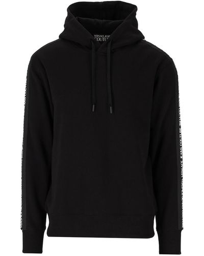 Sweatshirts & Sweaters Versace Jeans Couture - Multi logo hoodie in black -  71GAIP04CF00P899