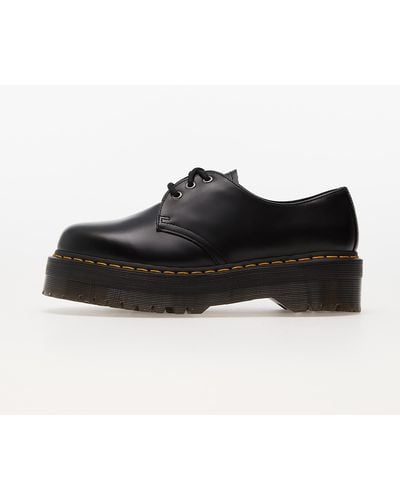 Dr. Martens Derbys holly noirs en cuir à plateforme