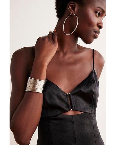 Free People Plated Omega Closure Hoops At In 14k Gold - Black