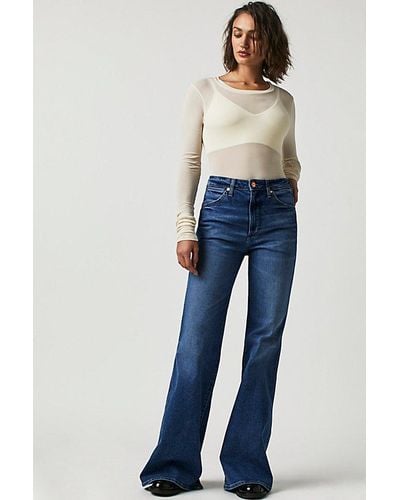 Wrangler Wanderer High Rise Flare Jeans At Free People In Smoke Sea, Size: 25 - Blue
