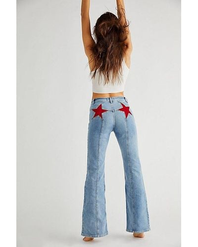 Free People Firecracker Flare Jeans At Free People In Mid Stone Wash, Size: 24 - White