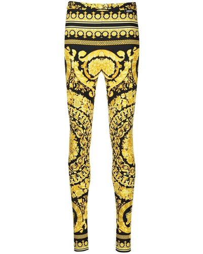 Versace Leggings in tessuto stretch oro e nero con stampa baroque heriatge allover - Giallo