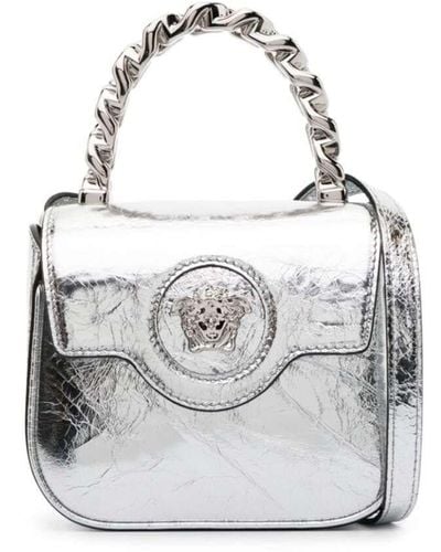 Versace Mini borsa a o con dettaglio medusa in pelle laminata argento - Bianco
