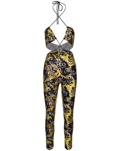 Versace Black And Gold Halterneck Jumpsuit With Logo Couture Print All-over In Polyester Woman - Yellow