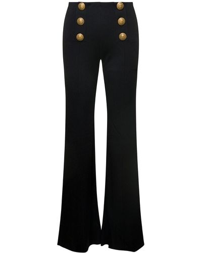 Balmain Pantaloni in maglia svasati con sei bottoni gioiello in viscosa nera - Nero