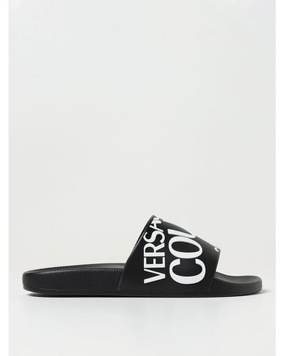 Versace Jeans Couture Sandalias slip-on con logo estampado - Negro