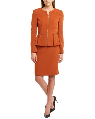 Orange zip top skirt suit