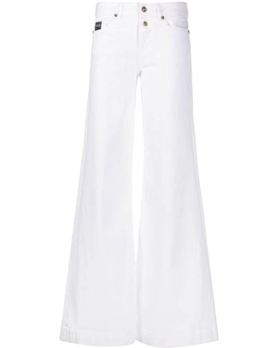 Versace Jeans Couture Jeans a gamba ampia con applicazione - Bianco