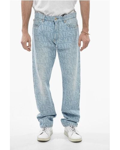 Versace Light Wash Mitchel Denims With All Over Logoed Pattern - Blue