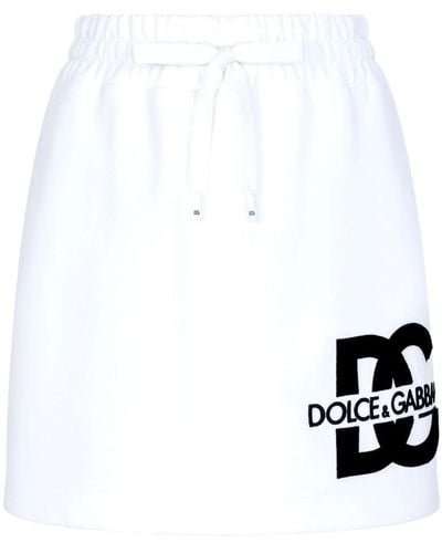 Dolce & Gabbana Minigonna in jersey con patch logo DG - Bianco