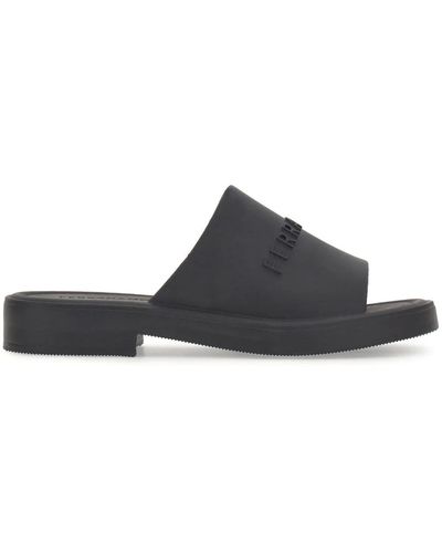 Ferragamo MULES IN GOMMA CON LOGO IMPRESSO - Nero