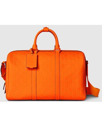 Gucci GG Rubber-effect Medium Duffle Bag - Orange
