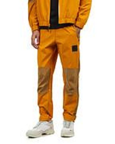 The North Face NSE Shell Suit Bottom - Gelb