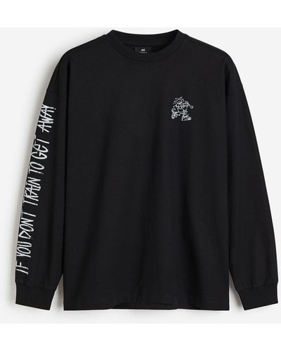 H&M Bedrucktes Jerseyshirt in Oversized Fit - Schwarz