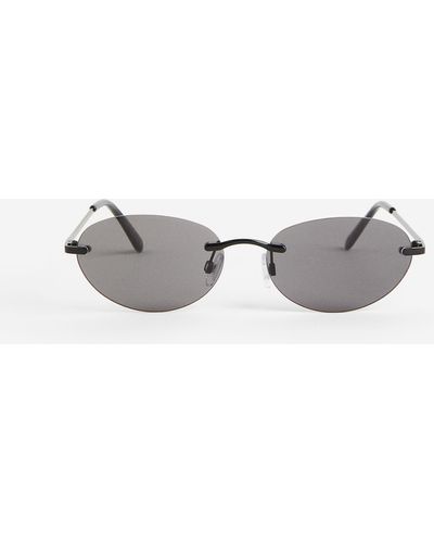 H&M Lunettes de soleil ovales sans monture - Noir