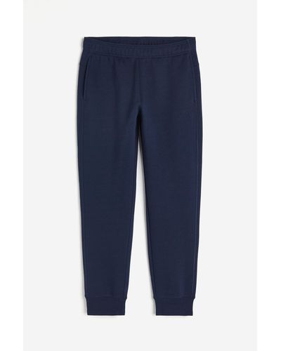 H&M Pantalon jogger de sport avec jambes effilées - Bleu