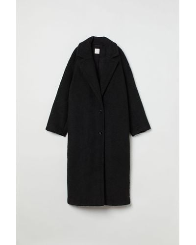 H&M Oversized Mantel aus Lammfellimitat - Schwarz