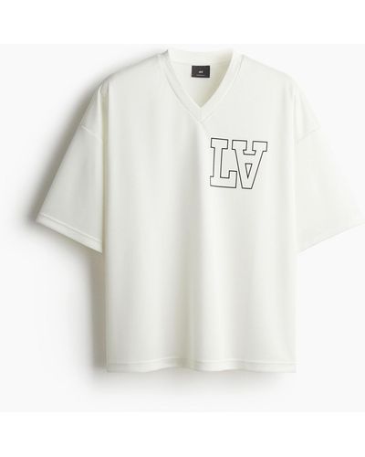 H&M Oversized T-Shirt aus Mesh mit Print - Weiß