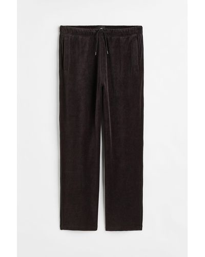 H&M Joggpants aus Velours Relaxed Fit - Schwarz